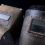 Two vintage, weathered Welding Helmets with rectangular viewports on a dark background.